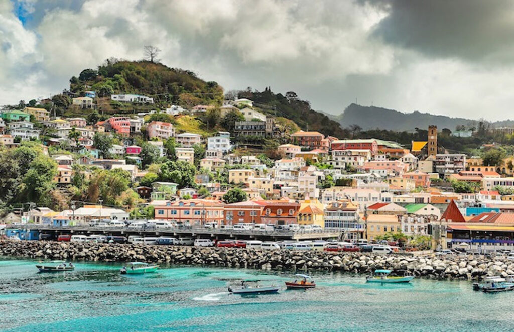 A photo of St. George's, Grenada, a colorful harbor town in the Caribbean.