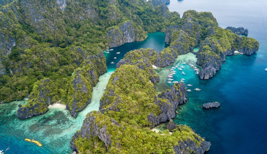 The image is of Small Lagoon, Philippines, Palawan a popular tourist destination known for its clear waters and coral reefs.