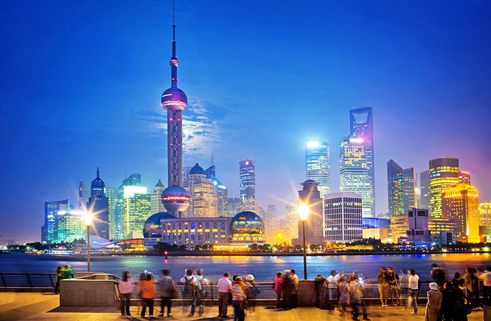 The picture is of the shanghai china the buildings turns golden beacause of sun set it is the top travel places to visit