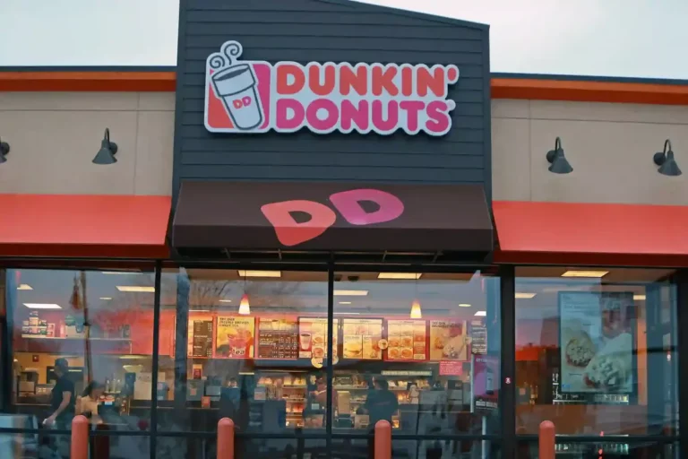 The image is of restaurant Dunkin’ Donuts Menu With Prices. In the image there is DD in the bold and Dunkin Donuts In the middle