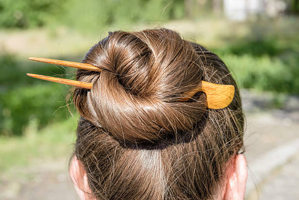 Playful Top Knot with Decorative Hair Pins Indian Wedding hairstyle