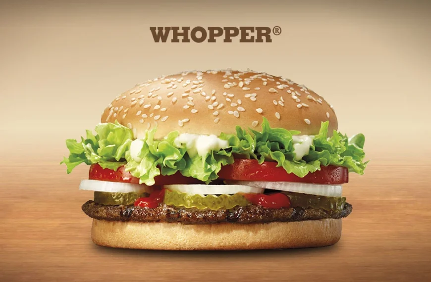 A juicy Burger King Whopper, featuring a sesame seed bun, a flame-grilled beef patty, lettuce, tomato, onion, pickles, and ketchup. (Burger King Whopper Calories)