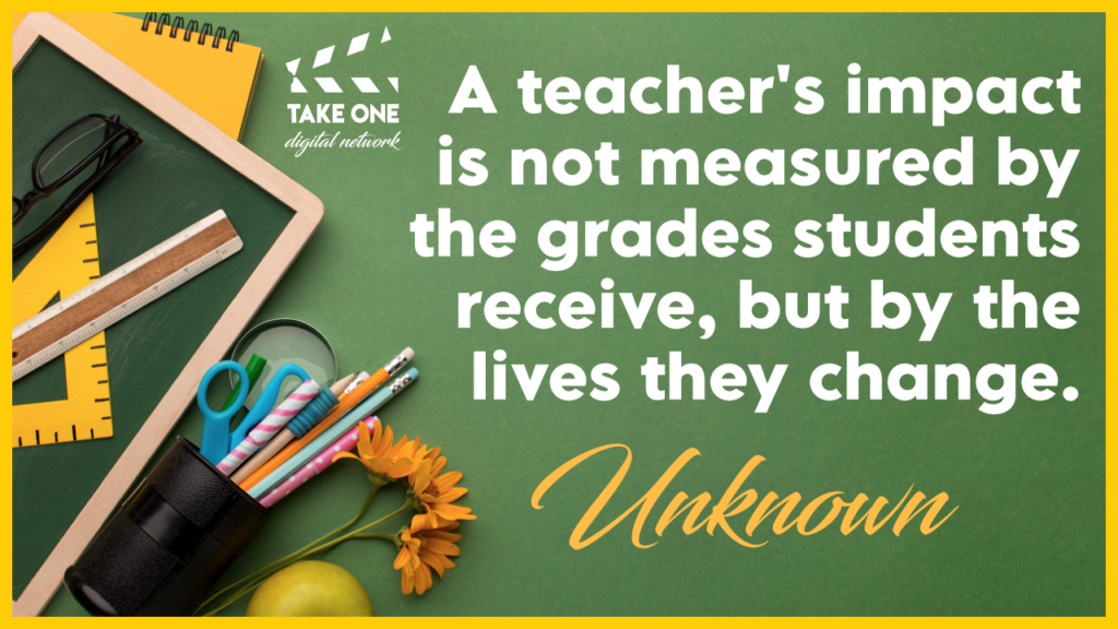 A quote about a teacher's impact being measured by the lives they change, not the grades students receive. The quote is written on a chalkboard surrounded by school supplies like a ruler, a pencil cup, and flowers.