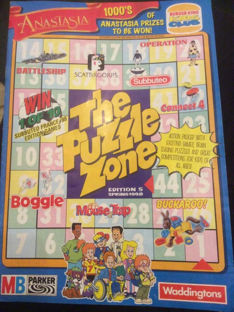 A Kids Club Puzzle Zone game board featuring the Anastasia movie. The board is filled with classic board games like Battleship, Scattergories, Subbuteo, Connect 4, Boggle, Mouse Trap, and Buckaroo! The board also includes a "Win a Subbuteo France '98 Edition Game" promotion. The image is from the spring 1998 edition of the puzzle zone to check the I.Q