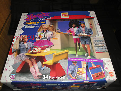  A Burger King Jazz Kids Club toy set featuring Barbie. The set includes 34 play pieces and a Burger King logo. The packaging is likely a cardboard box or plastic container.