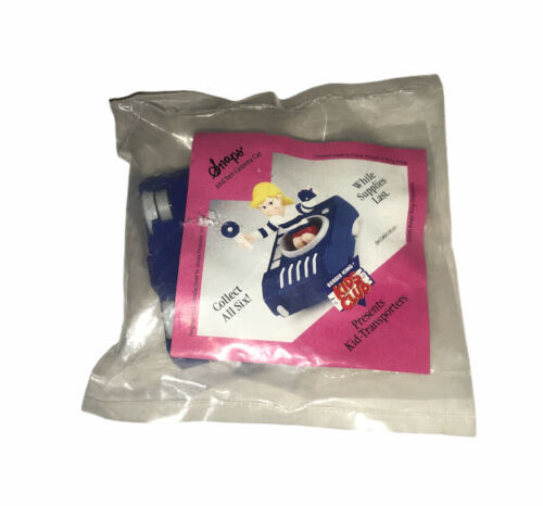 A sealed plastic bag containing a Burger King Kids Club toy. The toy is a blue car with a white stripe and a figure sitting inside. The packaging has text that says "Snaps," "Collect All Six," "While Supplies Last," and "Kid-Transporters."