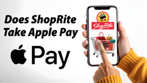 A person holding a smartphone with the ShopRite logo on the screen. The person's finger is touching the screen above a shopping cart icon. The text "Does ShopRite Take Apple Pay" is displayed at the top, and the Apple Pay logo is at the bottom.